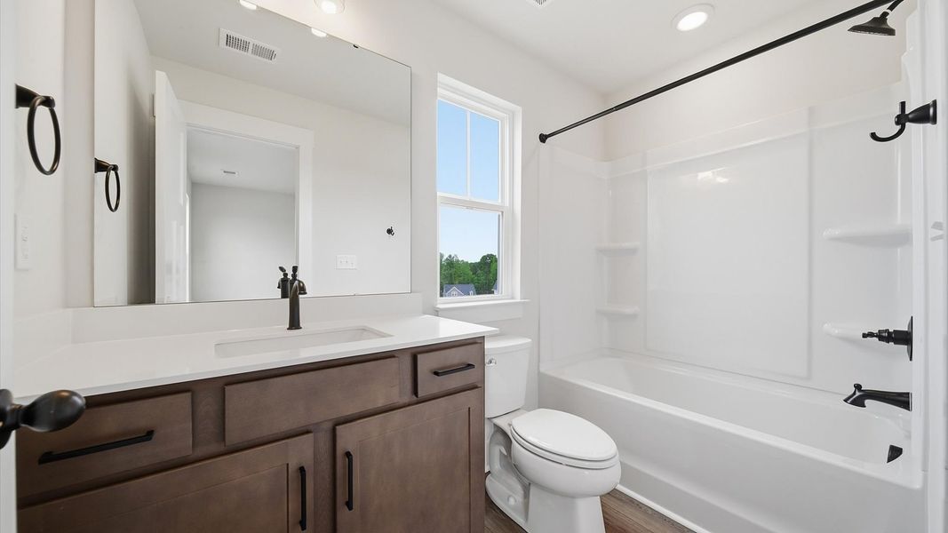 Top-notch bathroom with current fixtures, tasteful materials, and elevated charm located in Moore, SC