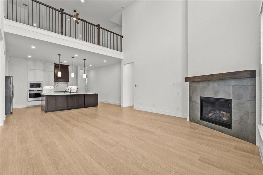 Two story Family Room open to the Chef's Kitchen