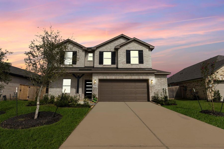 Twilight view of the home exudes charm and warmth, beautifully capturing its curb appeal as day turns to evening. Twilight view of the home exudes charm and warmth, beautifully capturing its curb appeal as day turns to evening.