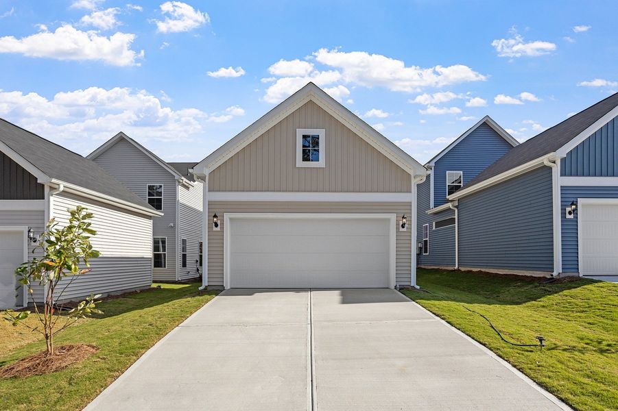 Front exterior of a new home in Renaissance at White Oak, Garner, NC, highlighting curb appeal (Image 16).