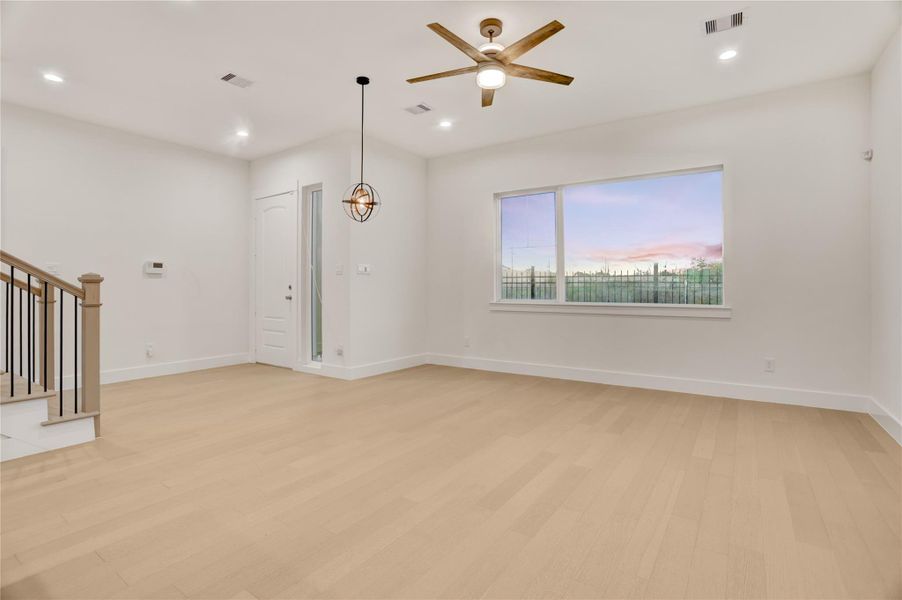 Details of the home are truly custom, note the modern designer lighting, custom fan choice, and detail of the upgraded finishes on staircase.