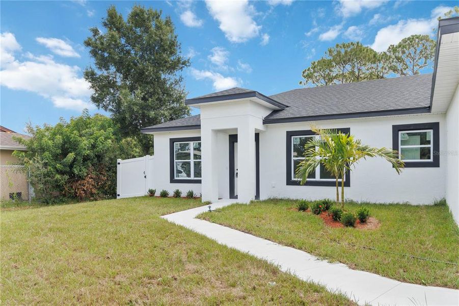 Front exterior of a new home in , Palm Bay, FL, highlighting curb appeal (Image 17). Front exterior of a new home in , Palm Bay, FL, highlighting curb appeal (Image 17).