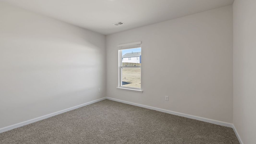 Spacious, unfurnished interior of a new home in Bentley Park, Greenwood (Image 22).