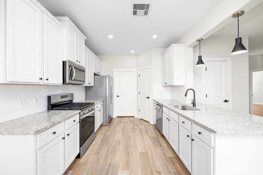 Furnished interior view inside a new home in Sunterra, Katy (Image 5).