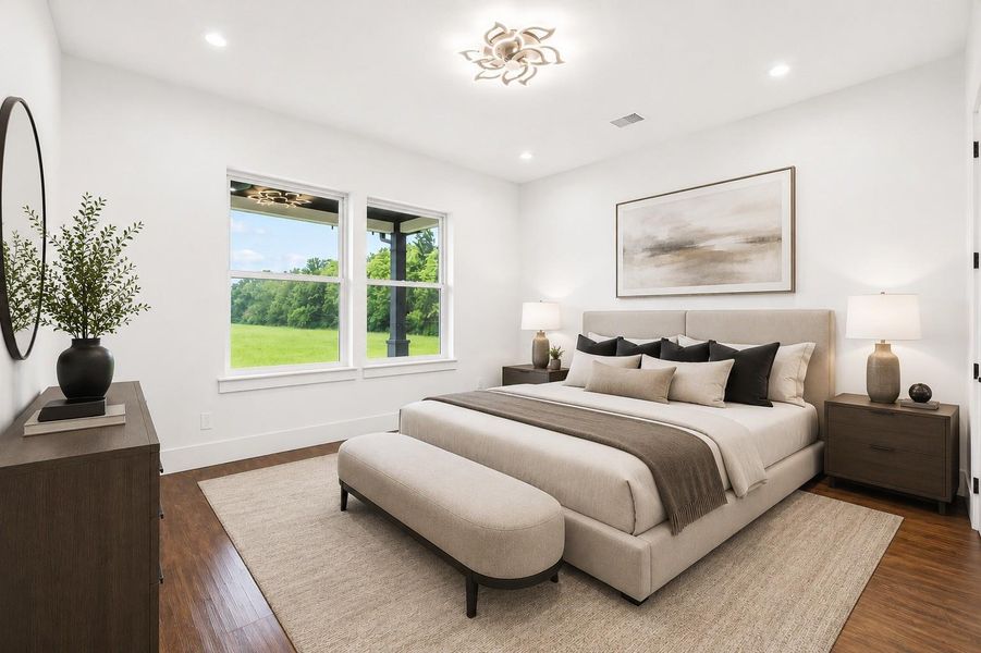 *Virtually Staged*Elegant primary suite featuring rich wood like flooring, designer lighting, oversized windows with peaceful property views, and a sophisticated contemporary design.