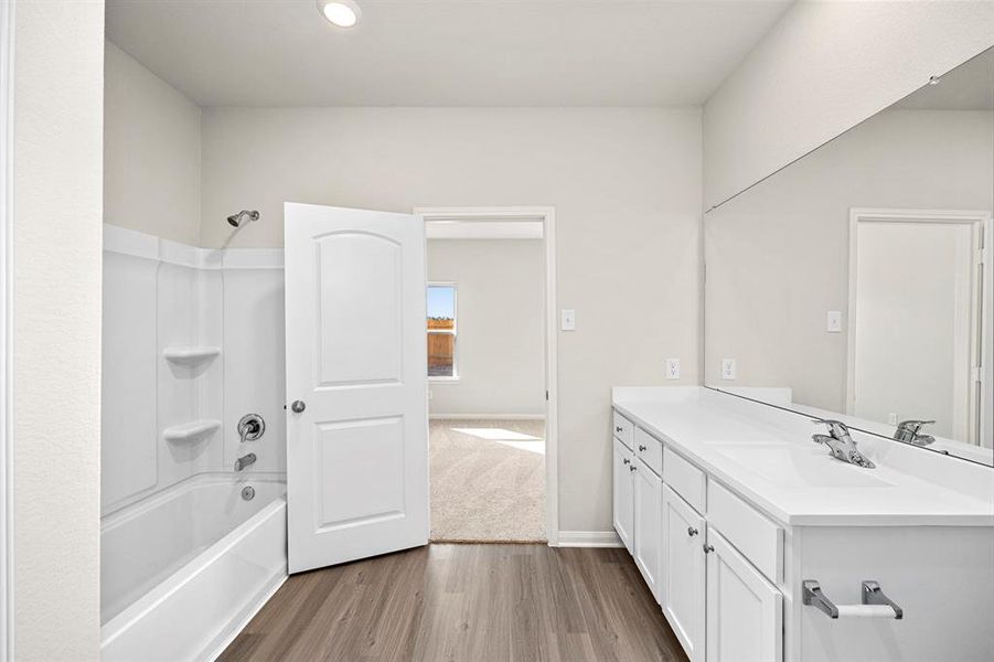 The primary bathroom has a shower/tub combo and a walk-in closet!