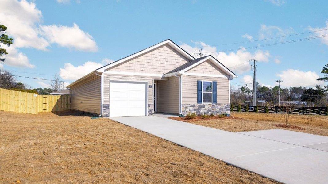 Front exterior of a new home in Evergreen Landing, Rossville, GA, highlighting curb appeal (Image 2).