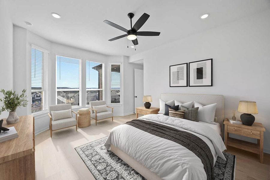 Bedroom featuring light wood-style flooring, recessed lighting, and a ceiling fan Bedroom featuring light wood-style flooring, recessed lighting, and a ceiling fan