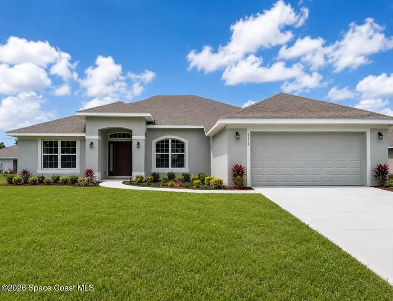 Front exterior of a new home in Palm Bay, Palm Bay, FL, highlighting curb appeal (Image 1). Front exterior of a new home in Palm Bay, Palm Bay, FL, highlighting curb appeal (Image 1).
