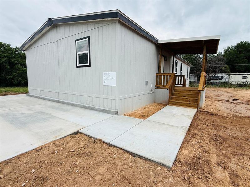 Exterior details and patio area of a home in , Granbury (Image 19).