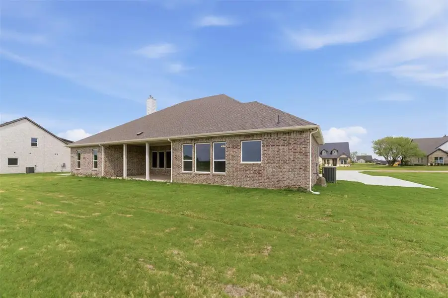 Exterior details and patio area of a home in Fannin Ranch, Leonard (Image 3).