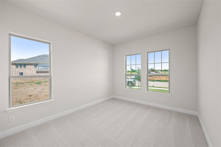 Empty room featuring carpet floors and recessed lighting
