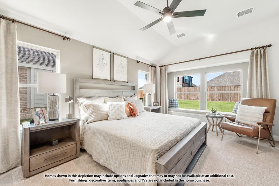 Bedroom with king bed, vaulted ceiling, ceiling fan, and large windows with backyard view