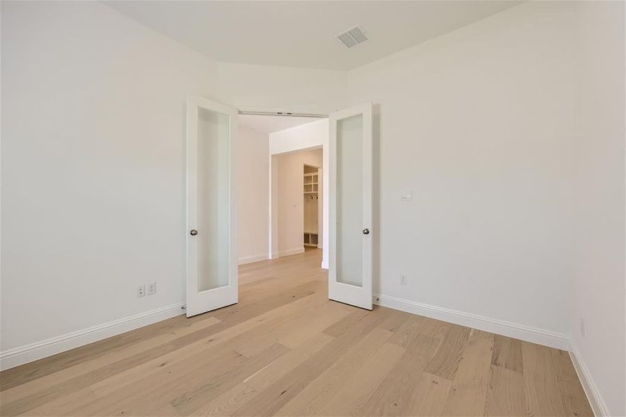 Spare room with light hardwood / wood-style flooring