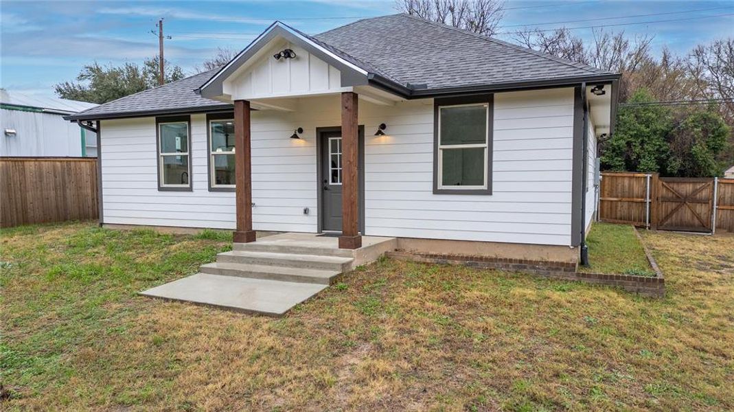 Bungalow-style house with a front yard