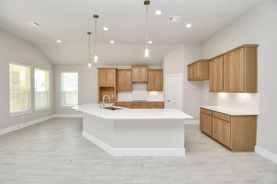 This kitchen is by far any chef’s dream! This spacious kitchen features high ceilings, stained wood cabinets, granite countertop, SS appliances, modern tile backsplash, recessed lighting, extended counter space, granite kitchen island with double sink, and space for breakfast bar, and a walk-in pantry all overlooking your huge family room. This kitchen is by far any chef’s dream! This spacious kitchen features high ceilings, stained wood cabinets, granite countertop, SS appliances, modern tile backsplash, recessed lighting, extended counter space, granite kitchen island with double sink, and space for breakfast bar, and a walk-in pantry all overlooking your huge family room.