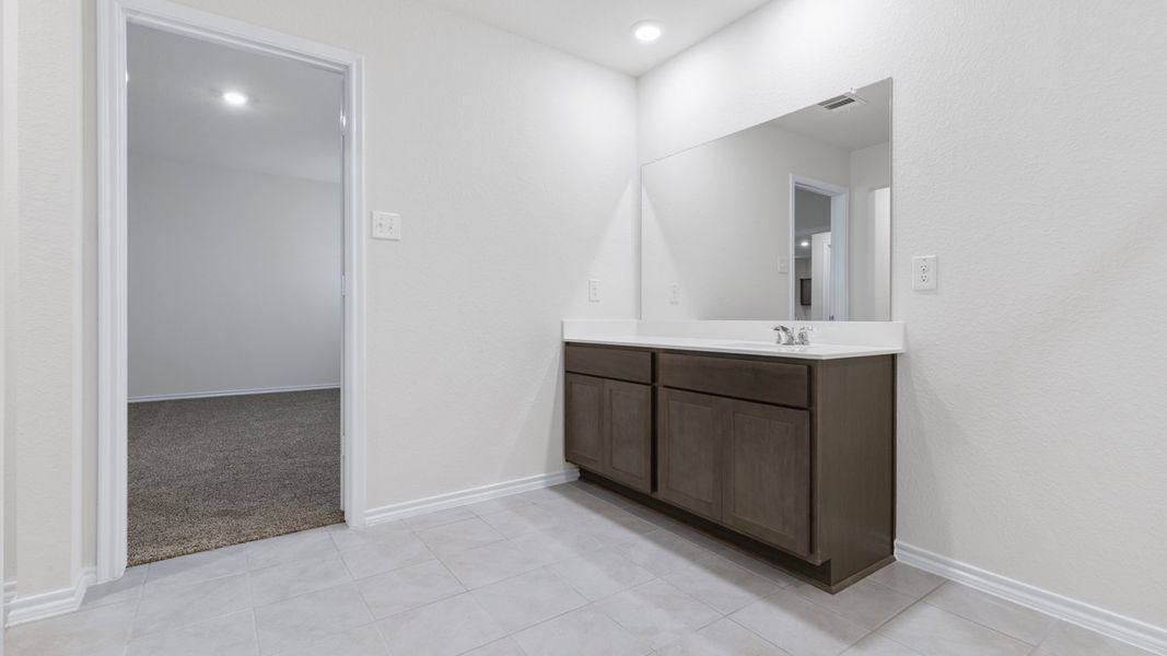 Representative furnished interior of a home built from the X40L Lakeway by D.R. Horton in Valor Farms, Royse City (Image 7).