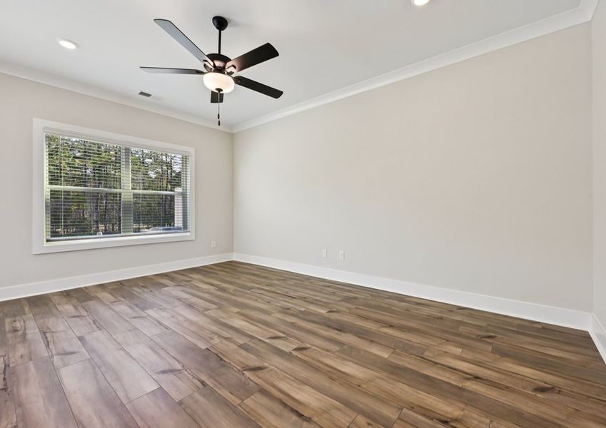 The living area features a ceiling fan.