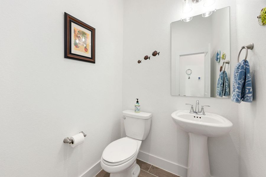 Half bathroom located on the second floor near the stairs