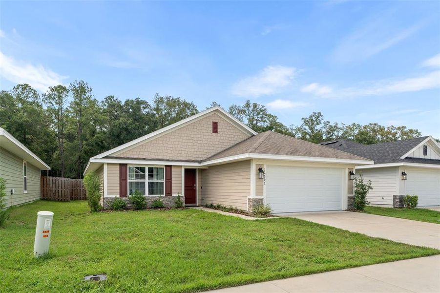 Front exterior of a new home in Savannah Station, Alachua, FL, highlighting curb appeal (Image 23). Front exterior of a new home in Savannah Station, Alachua, FL, highlighting curb appeal (Image 23).