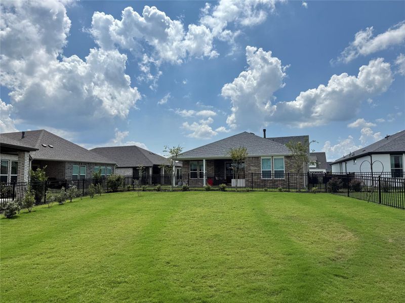 A backyard with plenty of room to grow your favorite trees and play with the grandkids.