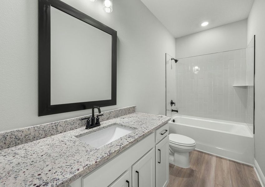 The secondary bathroom includes a shower tub combo.
