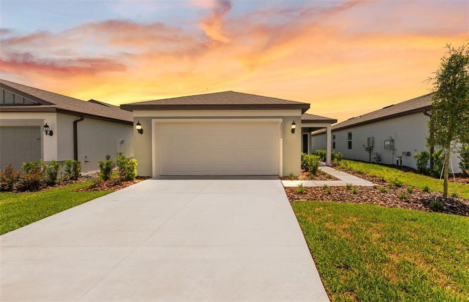 Front exterior of a new home in Twisted Oaks, Wildwood, FL, highlighting curb appeal (Image 1). Front exterior of a new home in Twisted Oaks, Wildwood, FL, highlighting curb appeal (Image 1).