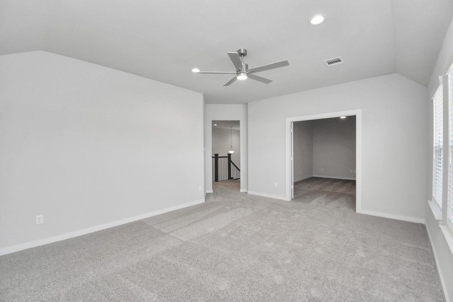 Come upstairs and enjoy a day of leisure in this fabulous game room! This is the perfect hangout spot or adult game room! Features plush carpet, high ceilings, custom paint and windows for plenty of natural light.