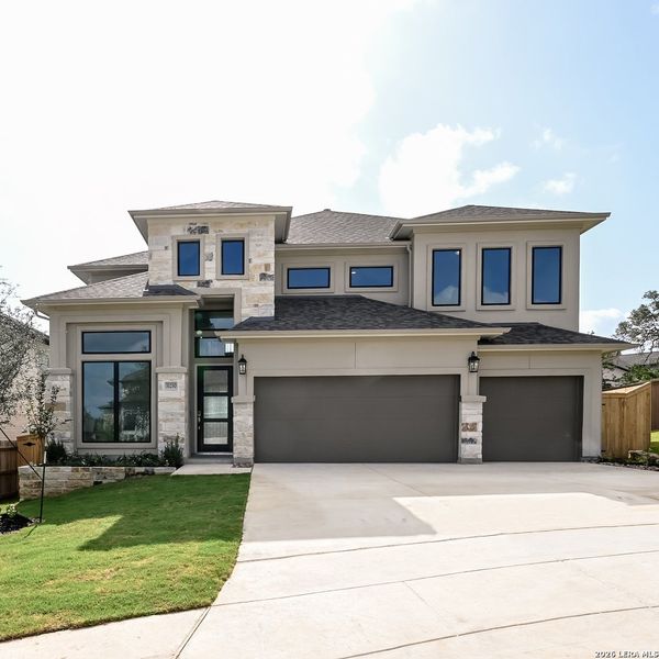 Front exterior of a new home in Johnson Ranch, Bulverde, TX, highlighting curb appeal (Image 1). Front exterior of a new home in Johnson Ranch, Bulverde, TX, highlighting curb appeal (Image 1).