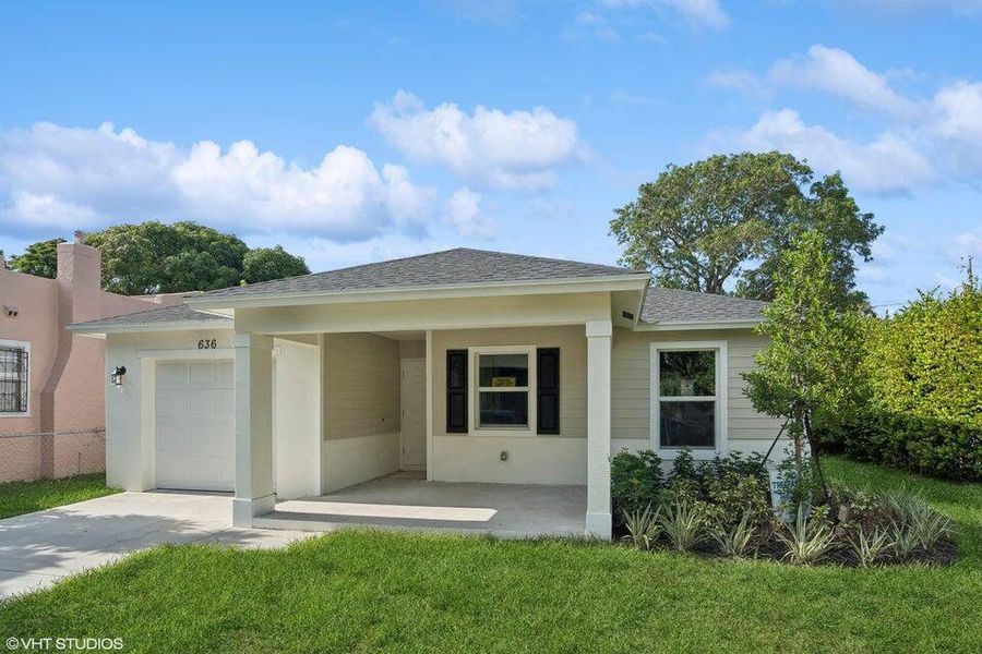 Front exterior of a new home in , West Palm Beach, FL, highlighting curb appeal (Image 13). Front exterior of a new home in , West Palm Beach, FL, highlighting curb appeal (Image 13).