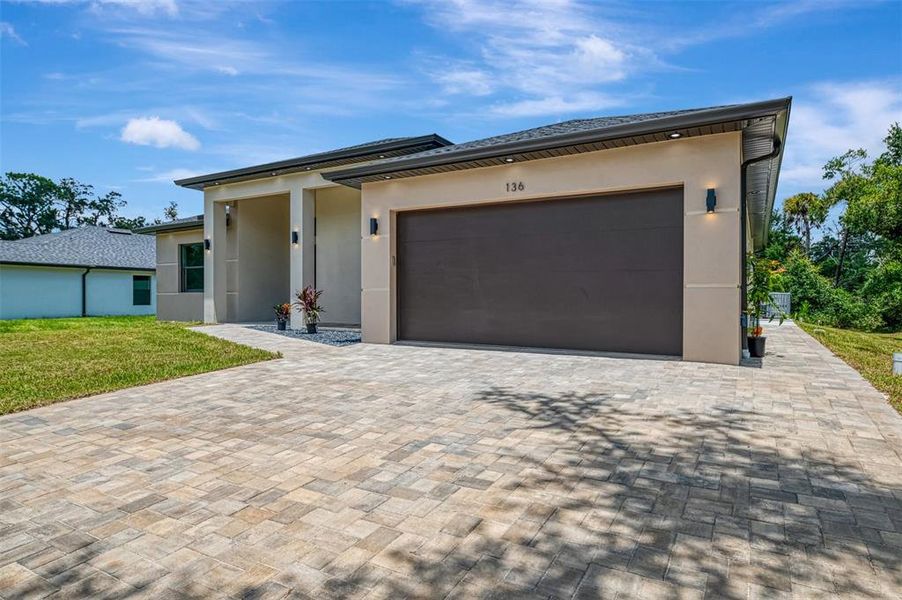 Front exterior of a new home in , Port Charlotte, FL, highlighting curb appeal (Image 2).