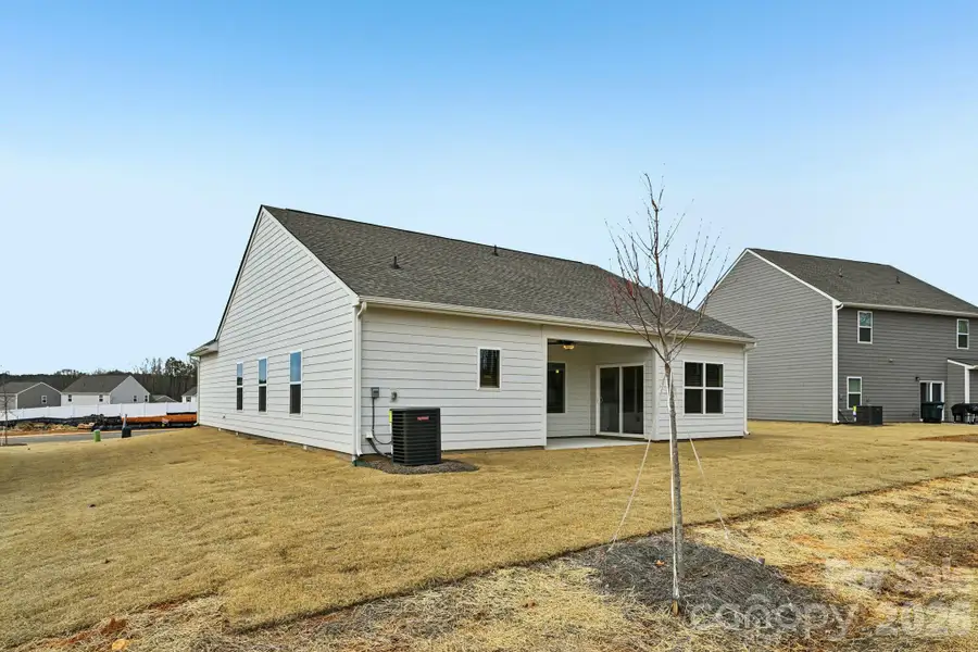 Exterior details and patio area of a home in Colonial Crossing, Troutman (Image 3).