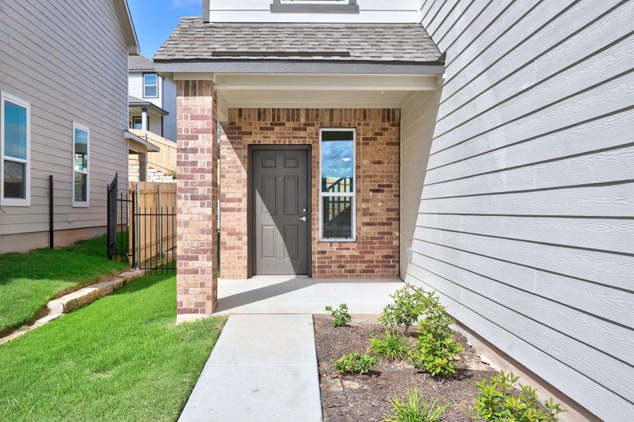 Exterior details and patio area of a home in Creekside at Estancia, Austin (Image 3).