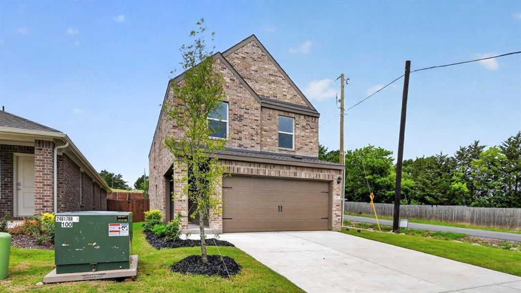 Front exterior of a new home in Hanolley Hills, Sherman, TX, highlighting curb appeal (Image 2). Front exterior of a new home in Hanolley Hills, Sherman, TX, highlighting curb appeal (Image 2).