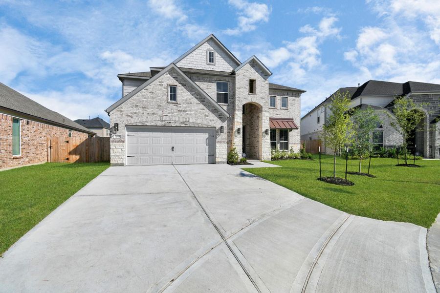 Home features a convenient 2-car garage complemented by a spacious driveway, offering ample parking for you and your guests.