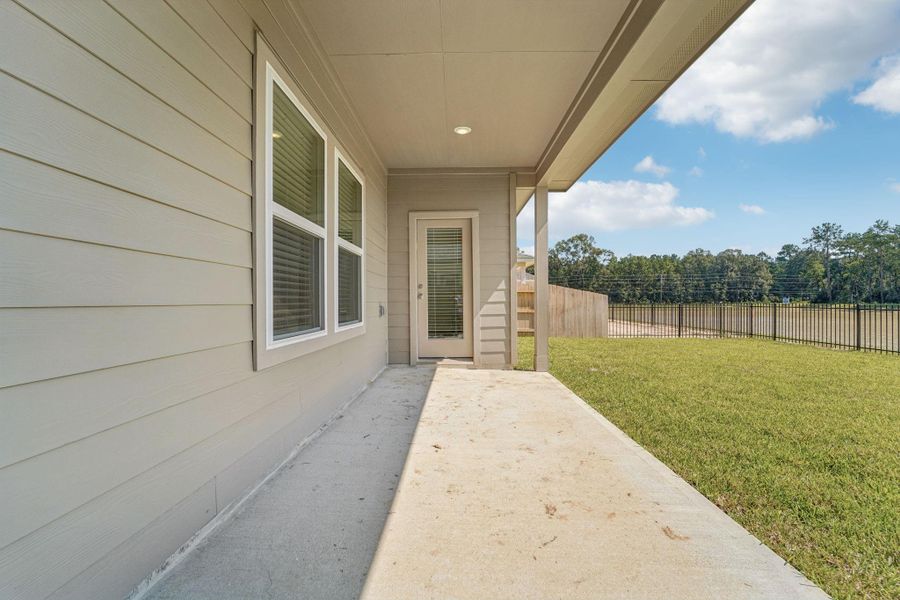 Front exterior of a new home in , New Caney, TX, highlighting curb appeal (Image 25).