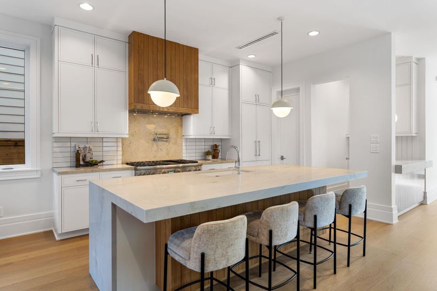 Note the Thermador appliance package with panel front refrigerator. Nicely sized walk-in pantry.