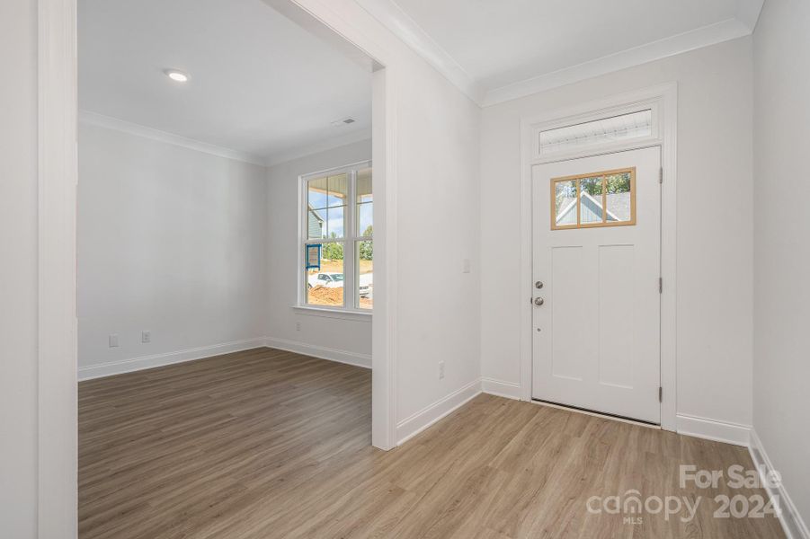 Representative Photo. Large & airy foyer hallway