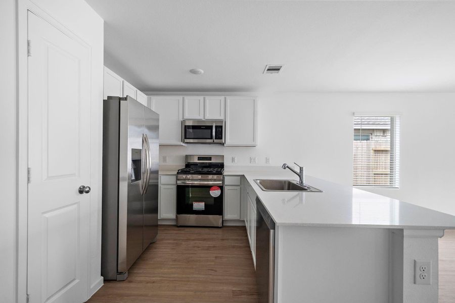 Beautiful kitchen with stainless steel appliances.