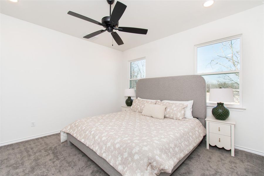 Bedroom featuring carpet flooring, recessed lighting, and a ceiling fan