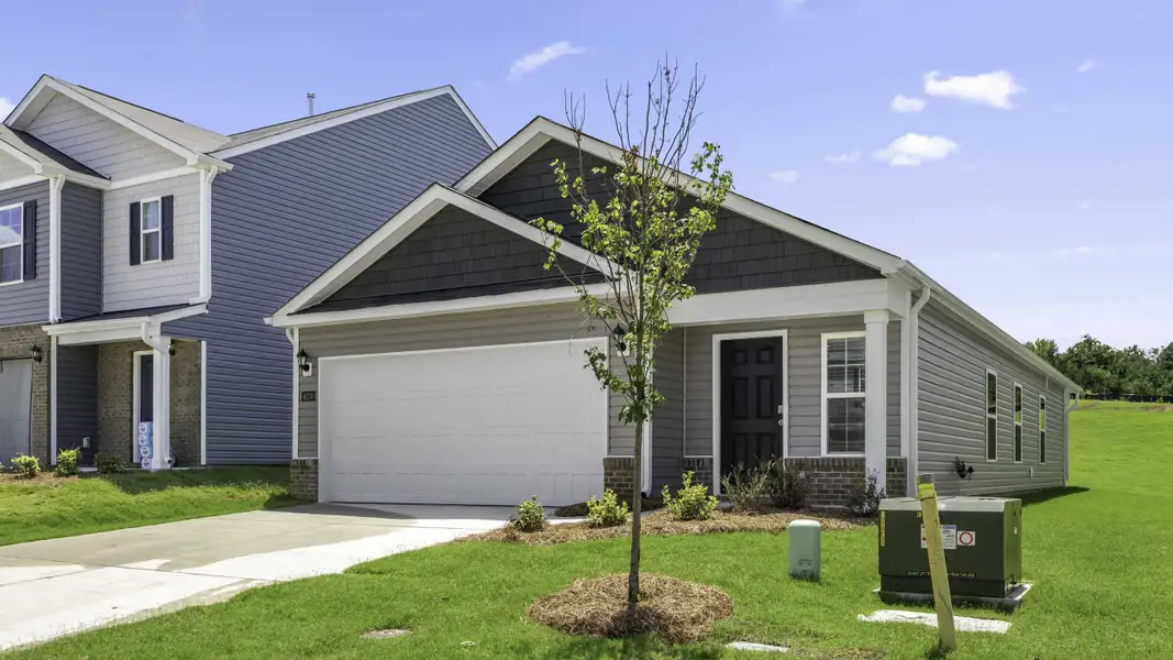 Front exterior of a new home in Fishel Village, Winston-Salem, NC, highlighting curb appeal (Image 2). Front exterior of a new home in Fishel Village, Winston-Salem, NC, highlighting curb appeal (Image 2).