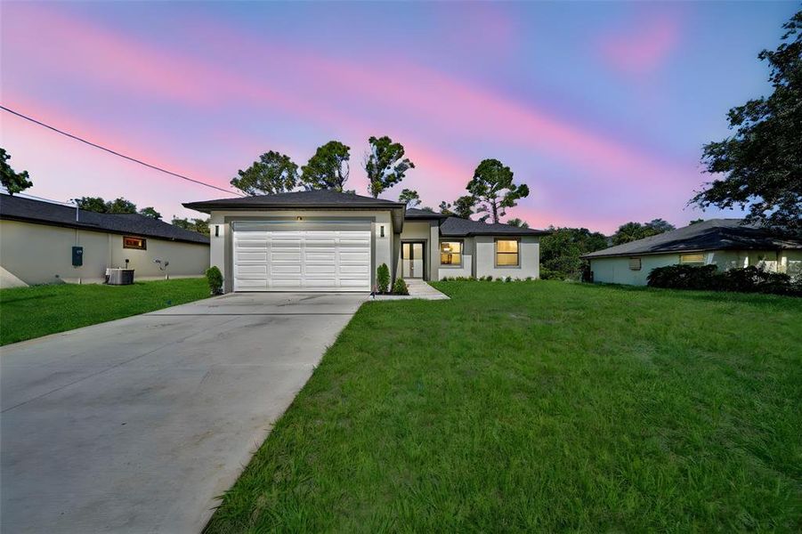 Front exterior of a new home in , Port Charlotte, FL, highlighting curb appeal (Image 18).