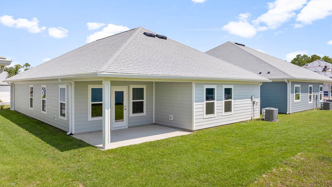 Front exterior of a new home in WindMark Beach, Port Saint Joe, FL, highlighting curb appeal (Image 18).