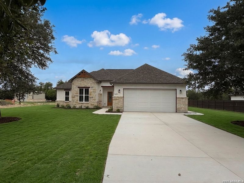 Front exterior of a new home in , Lytle, TX, highlighting curb appeal (Image 28).