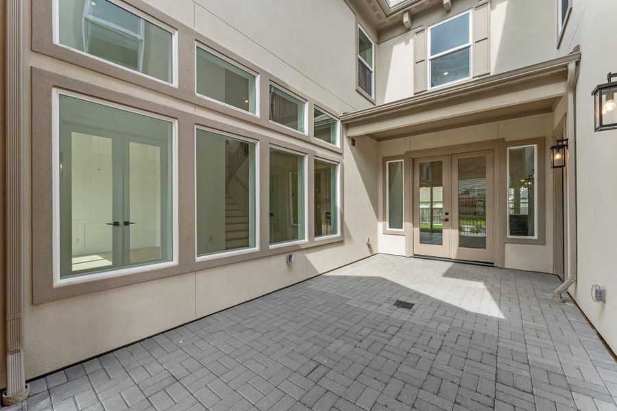 Exterior details and patio area of a home in , Spring (Image 24).