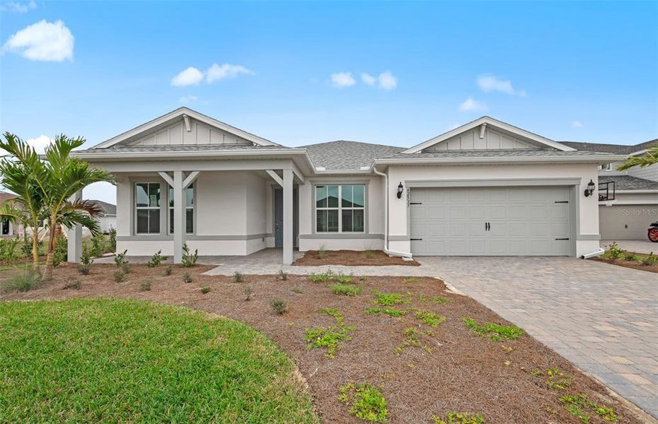 Front exterior of a new home in Sapphire Point at Lakewood Ranch, Lakewood Ranch, FL, highlighting curb appeal (Image 2).