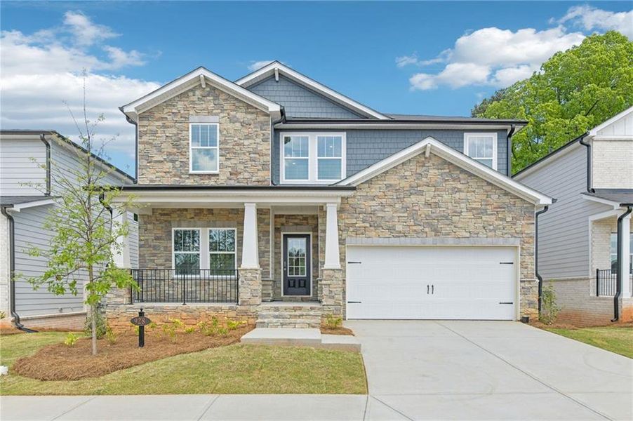 Front exterior of a new home in Martin Springs - Estate Series, Lawrenceville, GA, highlighting curb appeal (Image 26). Front exterior of a new home in Martin Springs - Estate Series, Lawrenceville, GA, highlighting curb appeal (Image 26).