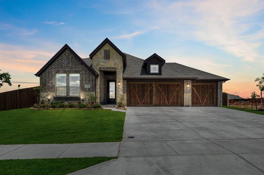 Front exterior of a new home in The Oaks, Red Oak, TX, highlighting curb appeal (Image 2). Front exterior of a new home in The Oaks, Red Oak, TX, highlighting curb appeal (Image 2).