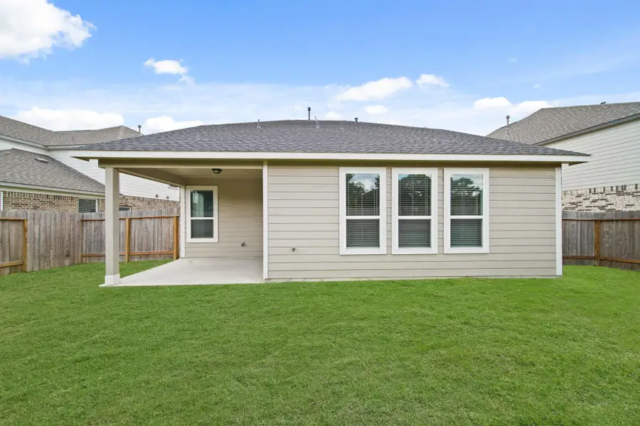 Front exterior of a new home in Grand Oaks – The Cove, Houston, TX, highlighting curb appeal (Image 2). Front exterior of a new home in Grand Oaks – The Cove, Houston, TX, highlighting curb appeal (Image 2).