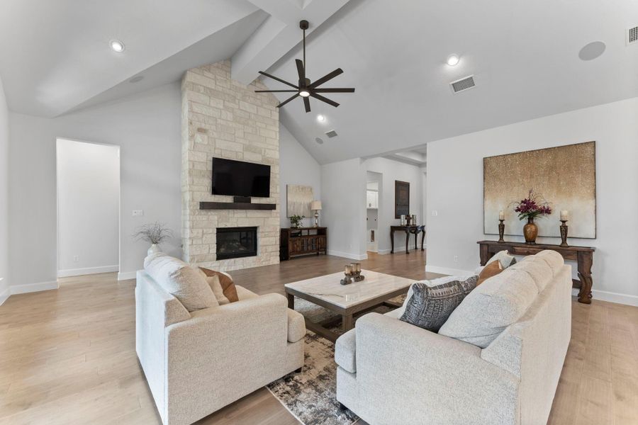 A close-up view of the living room, this photo focuses on the sitting area. The stone fireplace is a focal point of the room. A close-up view of the living room, this photo focuses on the sitting area. The stone fireplace is a focal point of the room.